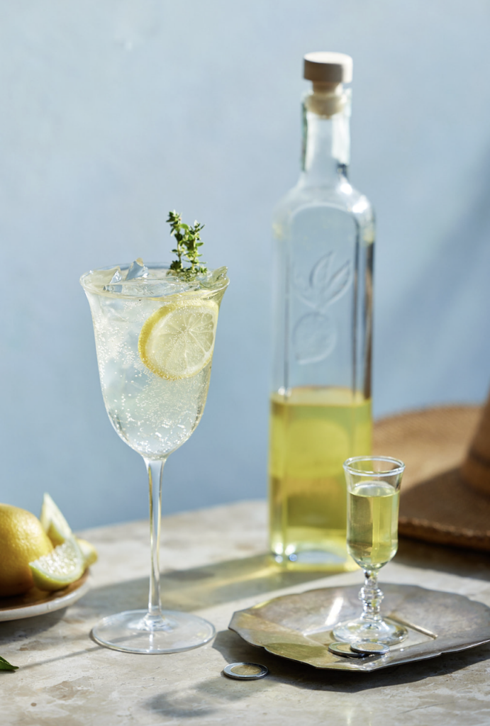 limoncello spritz with a bottle of limoncello
