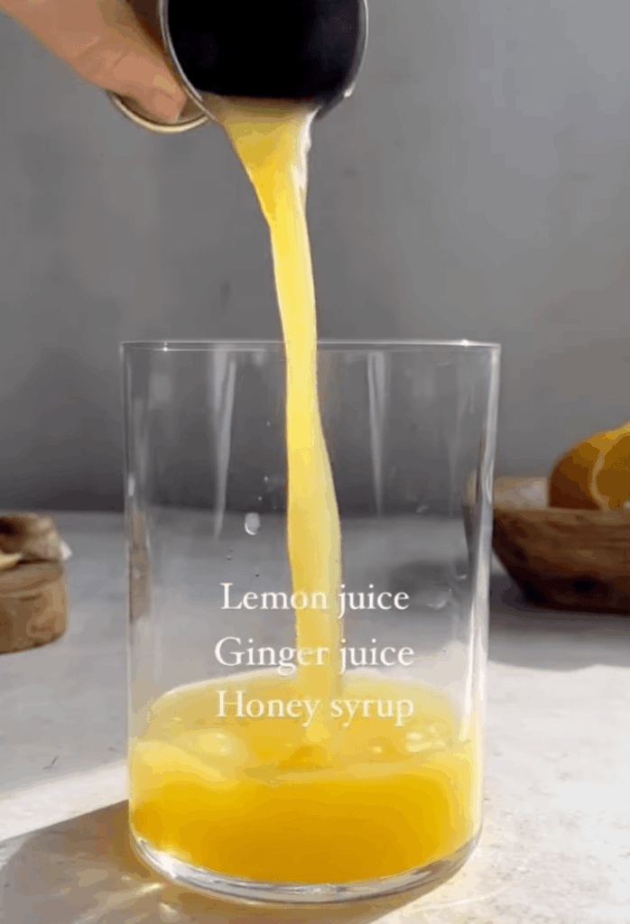 Lemon Ginger Mocktail Spritz ingredients: honey syrup, lemon juice, and ginger juice.
