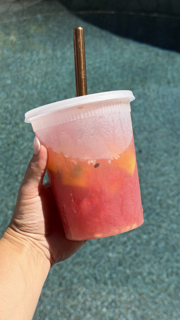 watermelon hugo spritz cocktail in a deli container