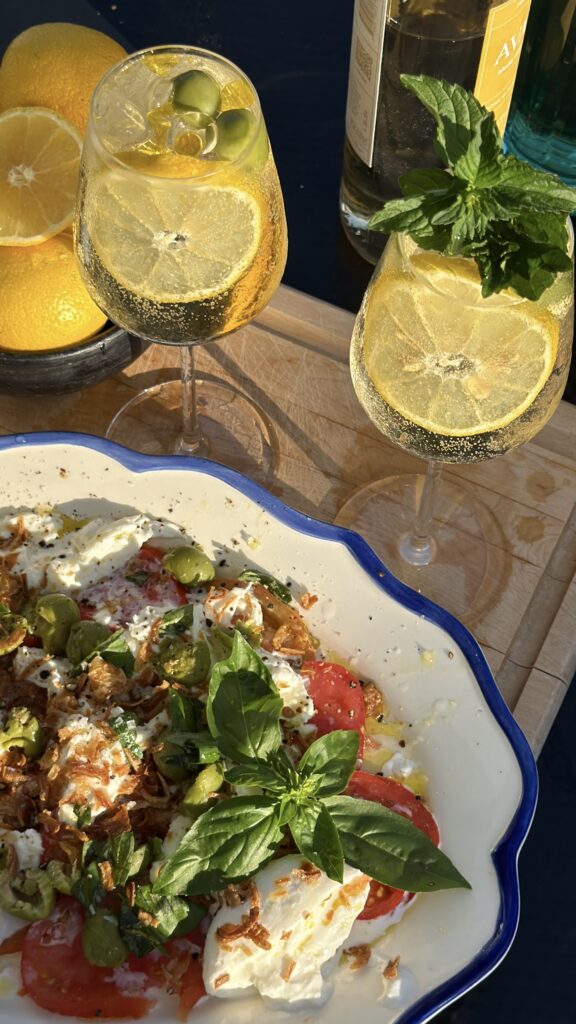 white wine spritz with tomato burrata snack plate appetizer